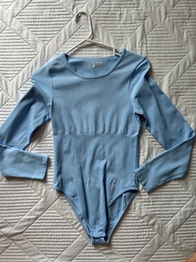 OQQ women’s Light Blue Long Sleeve Ribbed Bodysuit.